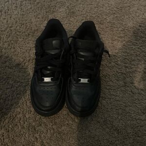 Kids low top black Nike air force ones
